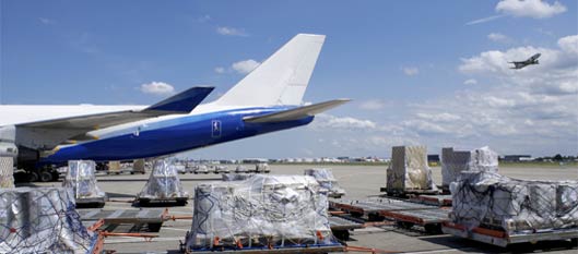 Cargo being loaded onto airplane image